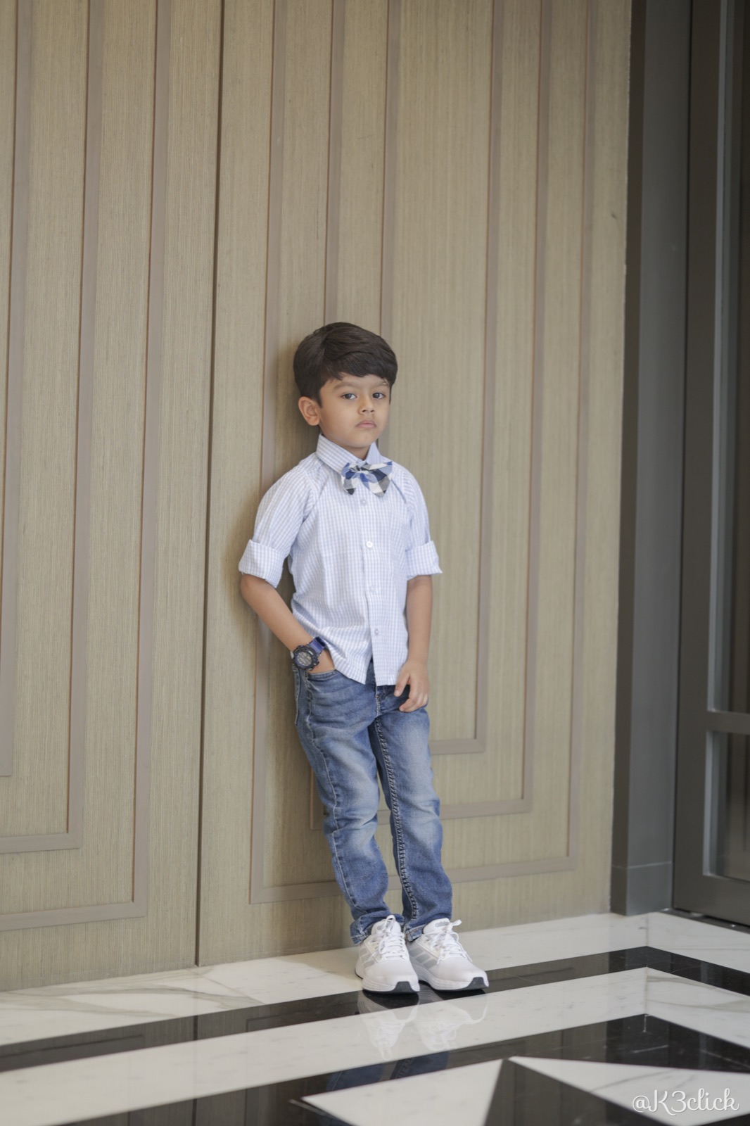 Blue gingham shirt with bow tie